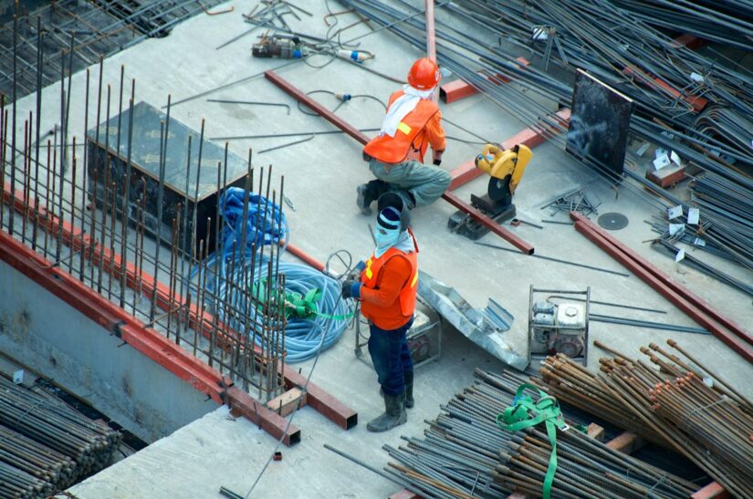 Commercial overhead door maintenance - technician inspecting industrial door